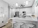 Modern kitchen with stainless steel appliances, breakfast bar, and bright countertops at 7052 Woodmore Ter, Lakewood Ranch, FL 34202