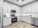 Well-equipped kitchen with stainless steel appliances, modern countertops, and ample cabinet space at 7052 Woodmore Ter, Lakewood Ranch, FL 34202