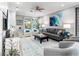 Well-decorated living room with a stylish rug, comfortable seating, and plenty of natural light at 7052 Woodmore Ter, Lakewood Ranch, FL 34202