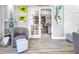 Sitting area with view into office featuring built-in shelves and decor at 7052 Woodmore Ter, Lakewood Ranch, FL 34202
