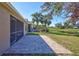 Paver patio overlooking a lush lawn and serene water views at 7214 35Th E Ln, Sarasota, FL 34243