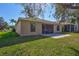 Beautiful backyard with paver patio, screened in lanai and well-kept lawn at 7214 35Th E Ln, Sarasota, FL 34243