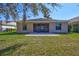 Expansive backyard featuring a screened-in patio with view of pond at 7214 35Th E Ln, Sarasota, FL 34243