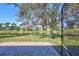 Patio overlooks the well maintained yard with a serene pond view at 7214 35Th E Ln, Sarasota, FL 34243