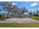Community basketball court with playground and benches at 7214 35Th E Ln, Sarasota, FL 34243