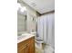 Neutral bathroom featuring a vanity with a sink, toilet, and shower with curtain at 7214 35Th E Ln, Sarasota, FL 34243