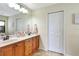 The spacious bathroom includes a double sink vanity with wood cabinets and ample storage at 7214 35Th E Ln, Sarasota, FL 34243