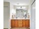 This bathroom features a double sink vanity and ample storage and linen space at 7214 35Th E Ln, Sarasota, FL 34243