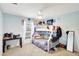 Charming bedroom with a bunk bed, desk, and ceiling fan, perfect for a  at 7214 35Th E Ln, Sarasota, FL 34243