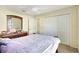 Cozy bedroom with a large bed, dresser, and mirror, creating a relaxing atmosphere at 7214 35Th E Ln, Sarasota, FL 34243