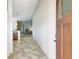Welcoming foyer with tile flooring and neutral paint, leading to the kitchen, living, and dining areas at 7214 35Th E Ln, Sarasota, FL 34243