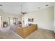 Spacious living room featuring high ceilings, a ceiling fan, and a large leather sectional at 7214 35Th E Ln, Sarasota, FL 34243
