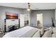 The spacious main bedroom includes a large tv and easy access to the ensuite bathroom at 7214 35Th E Ln, Sarasota, FL 34243