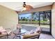 Screened-in patio features comfortable seating and a lovely water view at 7214 35Th E Ln, Sarasota, FL 34243