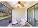 This covered patio offers comfortable seating and a beautiful view of the nearby pond at 7214 35Th E Ln, Sarasota, FL 34243