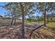 Community playground with swings, benches, and mature trees at 7214 35Th E Ln, Sarasota, FL 34243