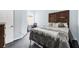 Cozy bedroom with neutral colors, a large bed, a window and a work desk at 7887 Limestone Ln # 12-102, Sarasota, FL 34233