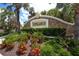 Stonehaven community entrance with lush landscaping and clear blue skies at 7887 Limestone Ln # 12-102, Sarasota, FL 34233