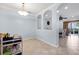 Multi-purpose space with view into dining room, archways, and tile flooring at 7887 Limestone Ln # 12-102, Sarasota, FL 34233