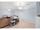 Multi-purpose room with tile floors, a ceiling fan, and ample natural light at 7887 Limestone Ln # 12-102, Sarasota, FL 34233