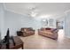 Spacious living room featuring tile flooring, neutral paint, and lots of natural light at 7887 Limestone Ln # 12-102, Sarasota, FL 34233