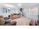 Spacious living room with tile floors, open floor plan, and plenty of natural light at 7887 Limestone Ln # 12-102, Sarasota, FL 34233