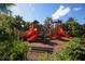 Outdoor playground area surrounded by lush greenery, providing a fun space for  at 7887 Limestone Ln # 12-102, Sarasota, FL 34233