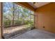 Screened in porch provides tranquil view of backyard landscaping and foliage at 7887 Limestone Ln # 12-102, Sarasota, FL 34233