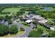 Majestic aerial view of luxurious golf course clubhouse, parking, and landscaping at 7934 Royal Birkdale Cir, Lakewood Ranch, FL 34202