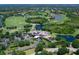 Beautiful aerial view of golf course, lush landscaping, and opulent clubhouse at 7934 Royal Birkdale Cir, Lakewood Ranch, FL 34202