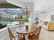 Cozy dining area with a view of the screened-in pool and the main living area at 7934 Royal Birkdale Cir, Lakewood Ranch, FL 34202