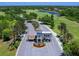 Aerial view of the gated entrance to the community with well-maintained landscaping and serene water views at 7934 Royal Birkdale Cir, Lakewood Ranch, FL 34202