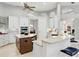 Gourmet kitchen with dual islands, stainless steel appliances, granite countertops, and custom white cabinetry at 7934 Royal Birkdale Cir, Lakewood Ranch, FL 34202