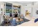 Open concept living room with access to the lanai and pool, showcasing a seamless indoor-outdoor living space at 7934 Royal Birkdale Cir, Lakewood Ranch, FL 34202