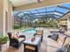 Outdoor patio and pool area with ample seating, perfect for relaxing and entertaining at 7934 Royal Birkdale Cir, Lakewood Ranch, FL 34202
