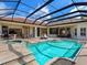Luxury pool and patio area with a spa, perfect for outdoor entertaining and relaxation at 7934 Royal Birkdale Cir, Lakewood Ranch, FL 34202