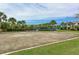 Community sand volleyball court with a net, offering a fun outdoor activity at 8926 Manor Loop # 206, Lakewood Ranch, FL 34202