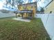 Spacious backyard featuring a gazebo on a concrete pad and a white vinyl fence at 9112 Bell Rock Pl, Land O Lakes, FL 34638