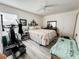 Cozy bedroom features light walls, hardwood floors, and a ceiling fan at 916 W Faith Cir, Bradenton, FL 34212