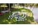 Waterfront outdoor venue featuring a fire pit surrounded by seating perfect for events and gatherings at 916 W Faith Cir, Bradenton, FL 34212