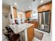 Modern kitchen with stainless steel appliances, granite countertops, and wood cabinetry at 916 W Faith Cir, Bradenton, FL 34212