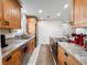 Well-equipped kitchen with stainless steel appliances, updated countertops, and ample cabinet space at 916 W Faith Cir, Bradenton, FL 34212
