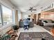 Bright office featuring a large window, ceiling fan, and neutral color palette adjoined to the main living area at 916 W Faith Cir, Bradenton, FL 34212