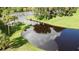 Overhead of waterfront view showing manicured lawn, palm trees, and waterfront ceremony space at 916 W Faith Cir, Bradenton, FL 34212