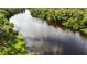 Beautiful aerial view of a river surrounded by lush greenery and trees at 916 W Faith Cir, Bradenton, FL 34212
