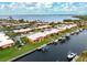 Aerial view of attached villas with canal access and boat lifts at 9527 Azure Cv, Bradenton, FL 34210