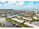 An attractive aerial view of waterfront homes with docks and boat access on a sunny day at 9527 Azure Cv, Bradenton, FL 34210