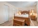 Comfortable bedroom with wooden bed frame, and ample closet space for a serene living space at 9527 Azure Cv, Bradenton, FL 34210