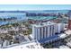 Beautiful condo building aerial view facing the bay, marina, and bridge in the distance at 101 S Gulfstream Ave # 14G, Sarasota, FL 34236
