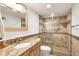Well-lit bathroom with modern shower and vanity at 101 S Gulfstream Ave # 14G, Sarasota, FL 34236
